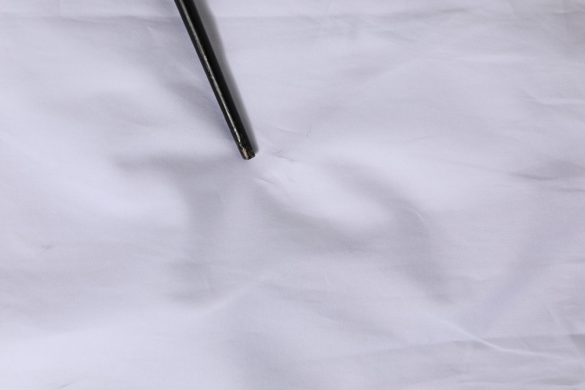 Black pen on white fabric