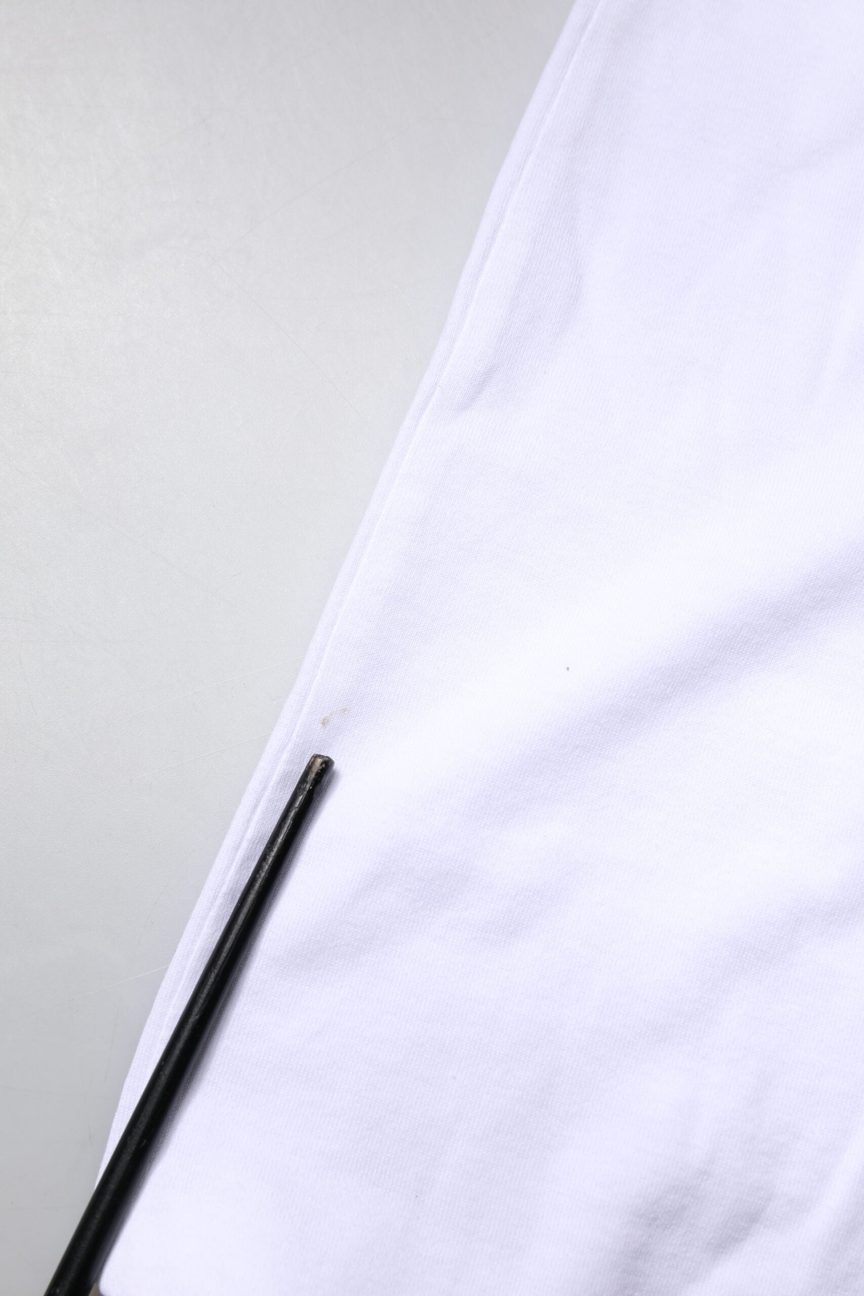 Black pen on white cloth