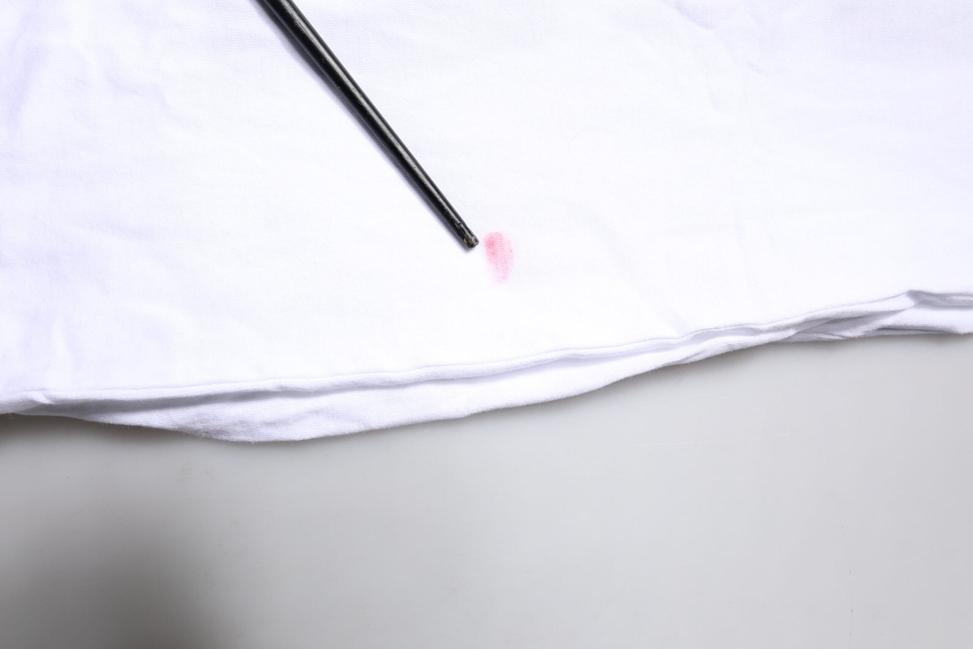 Black pen on white cloth