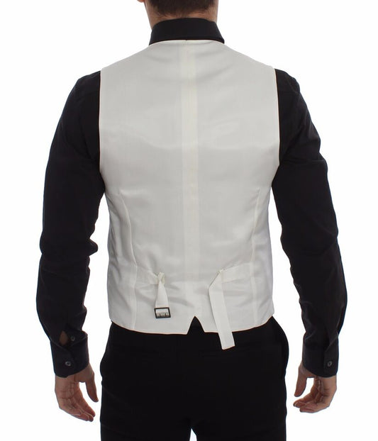 A white vest with a black shirt and tie, part of a formal outfit