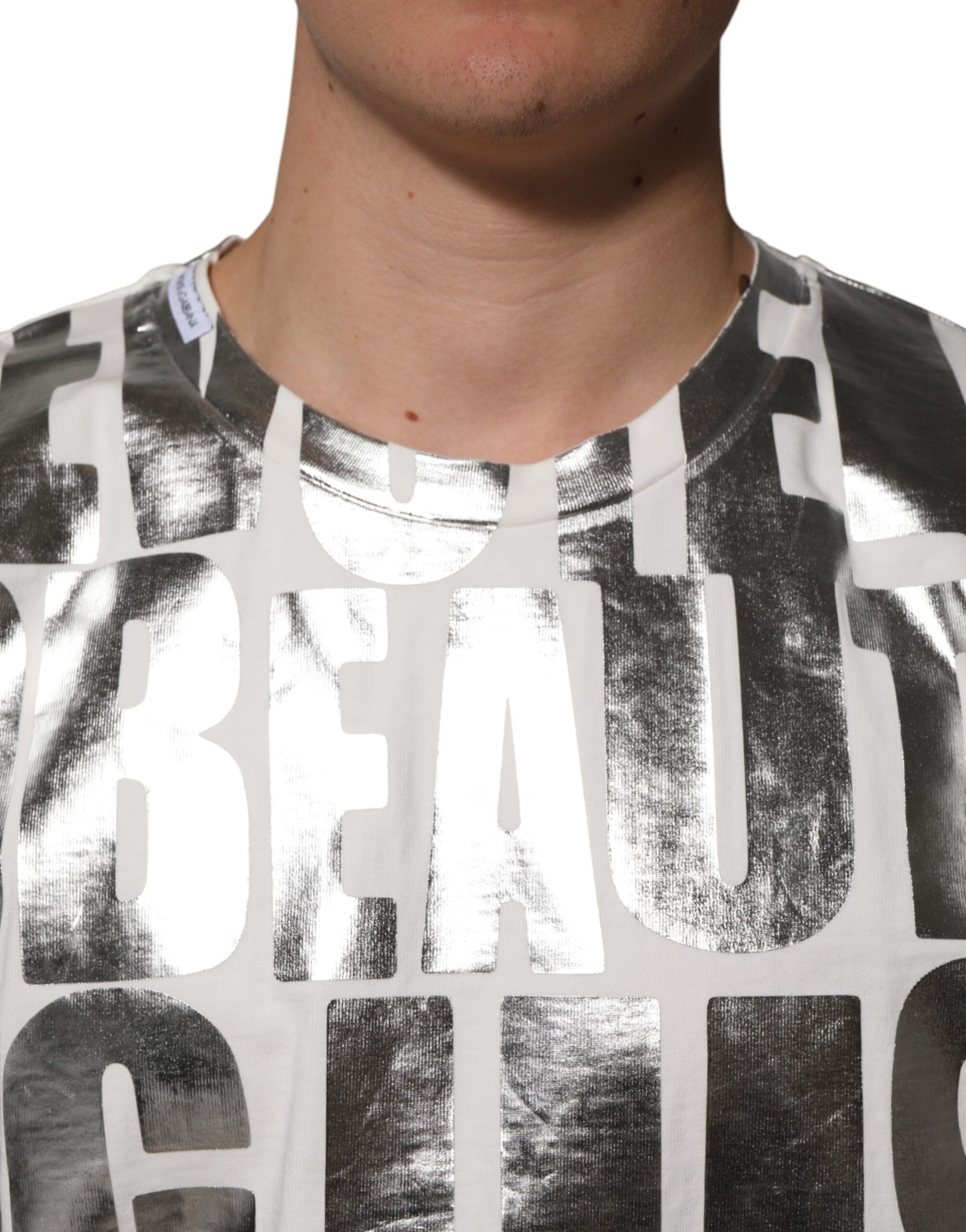 Man wearing a t-shirt with the word "beautiful" printed on it