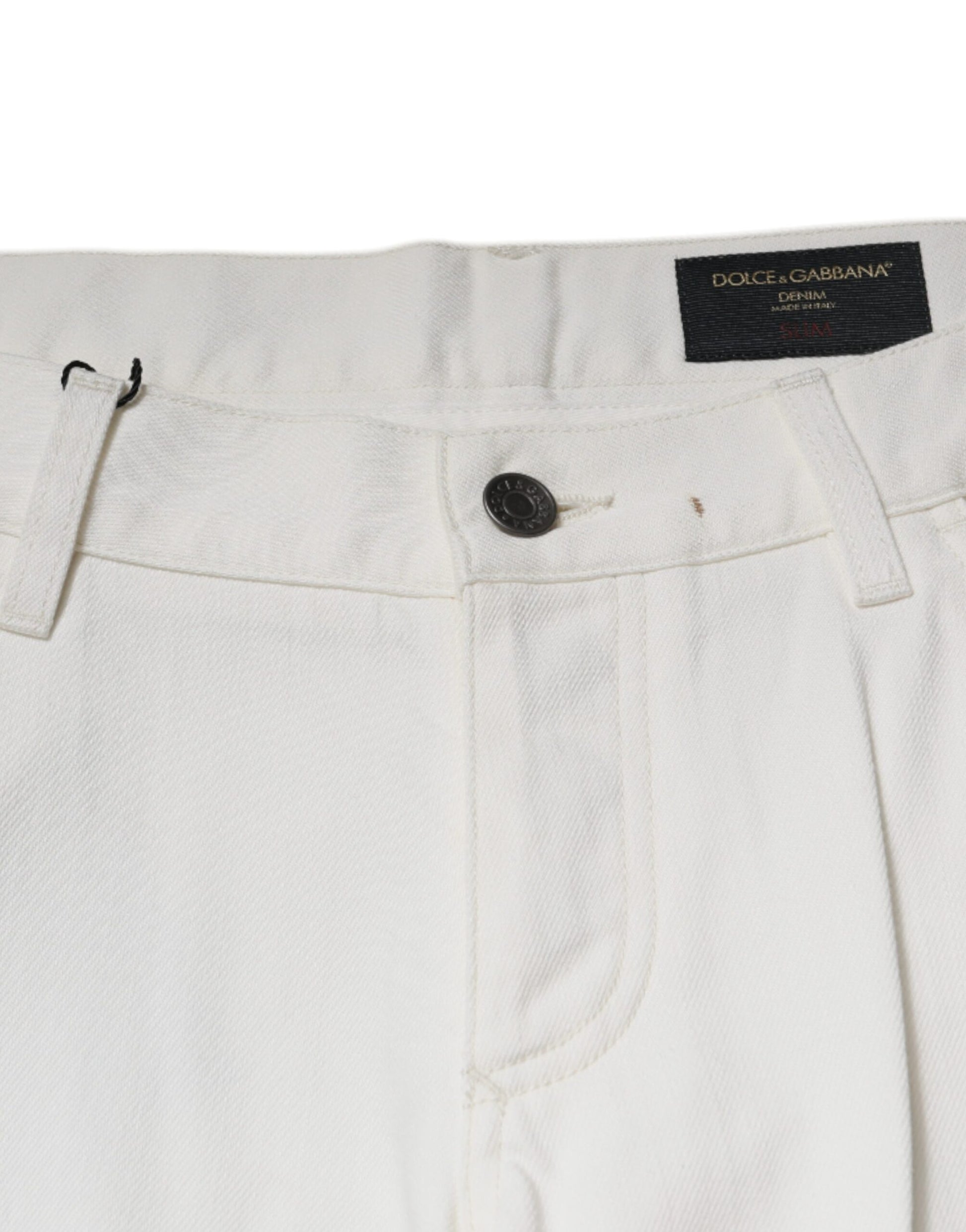 White pants with black label on waistband
