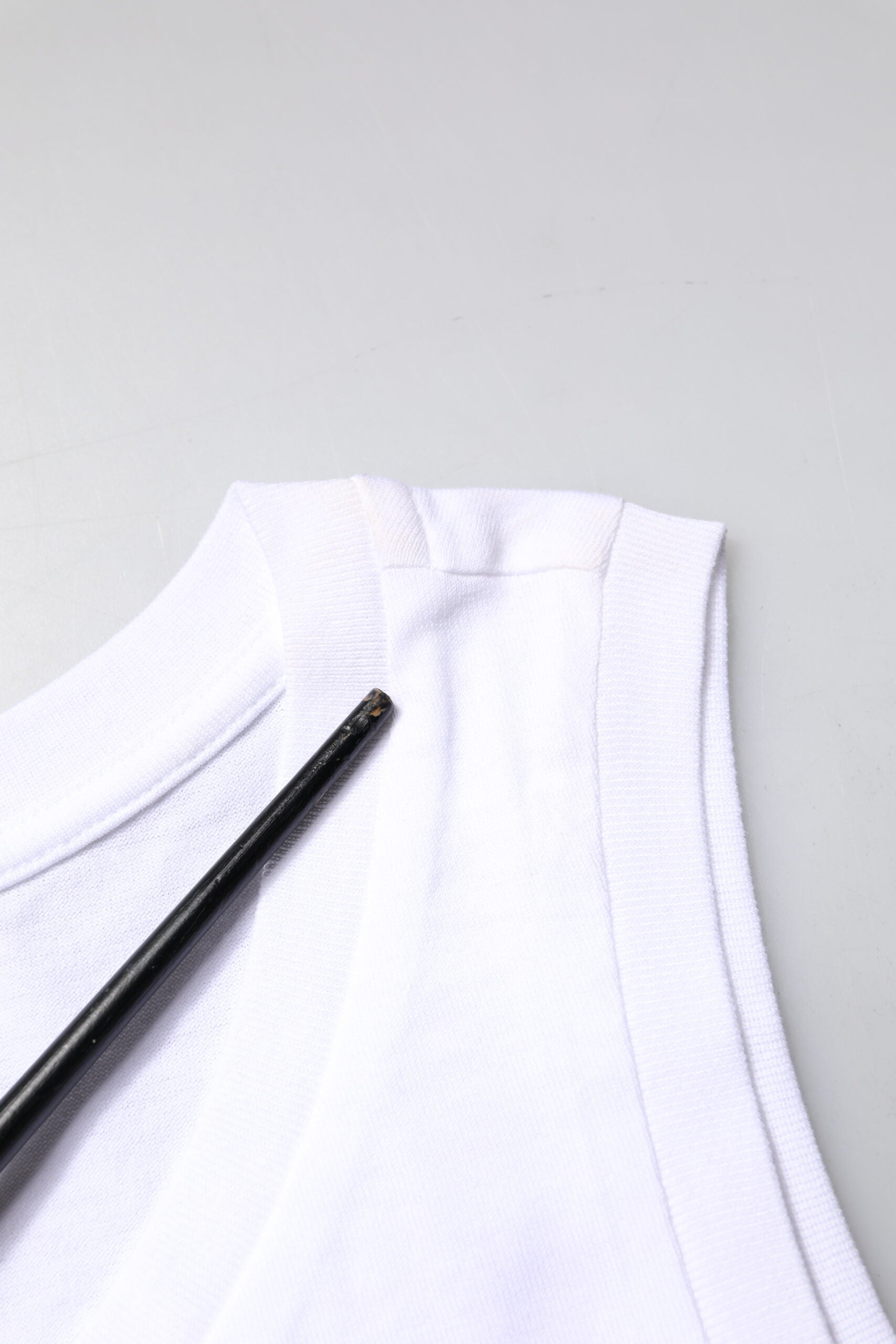 White shirt with black buttons