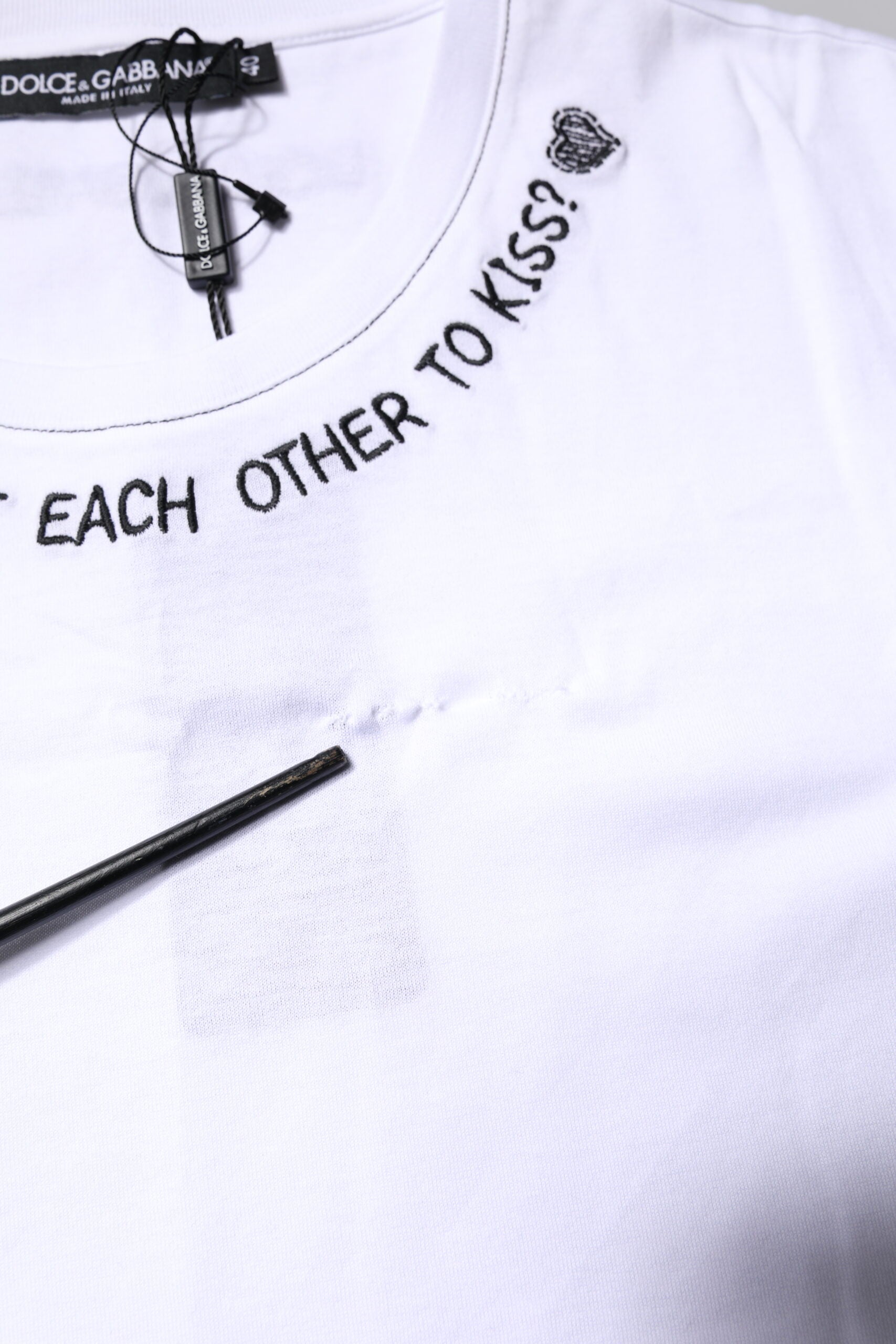 White t-shirt with black lettering