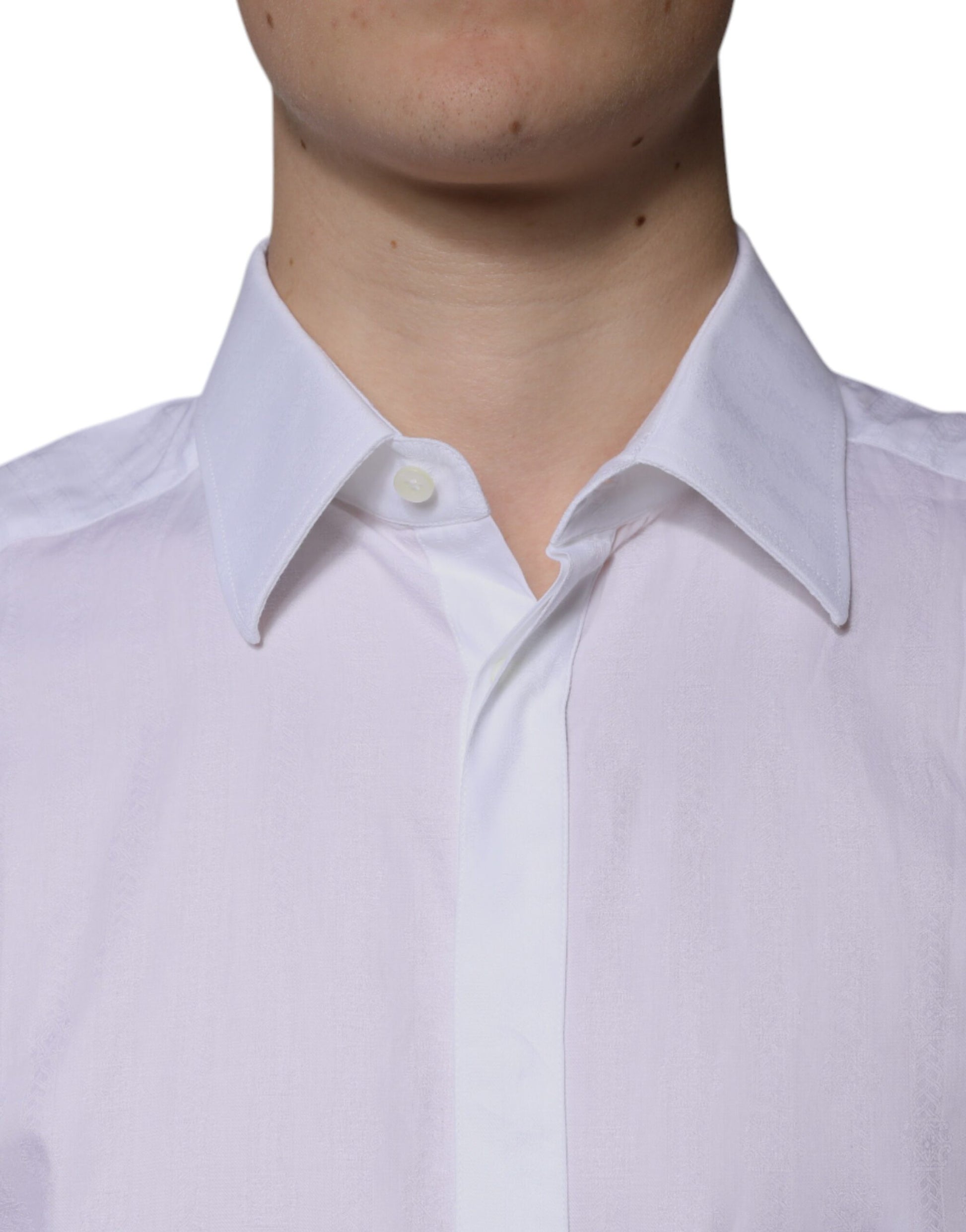 A mannequin wearing a white cotton dress shirt with a slim fit. The shirt has a collar and is designed for fo