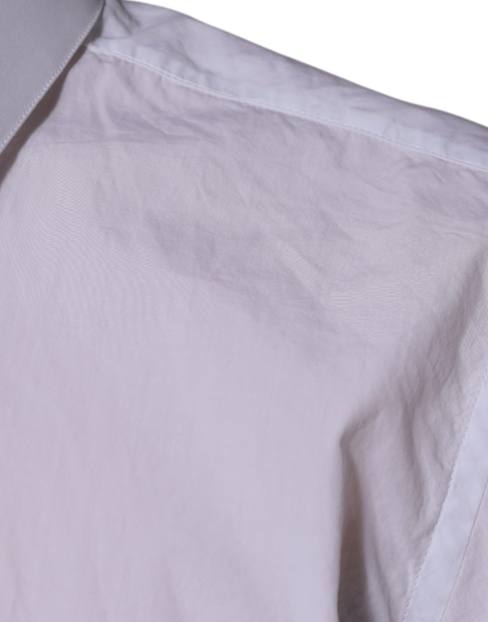 A white cotton dress shirt with a slim fit, featuring a collar and short sleeves