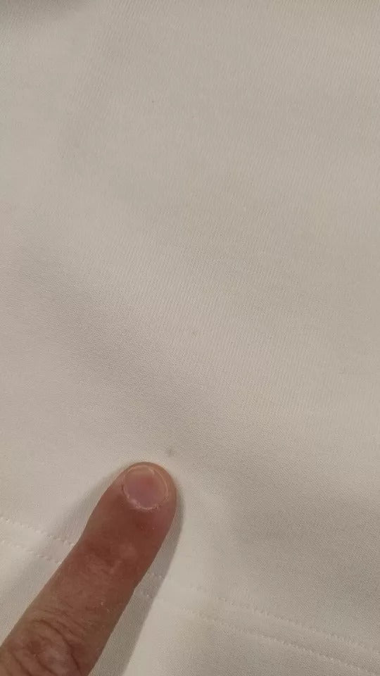 Hand pointing at fabric