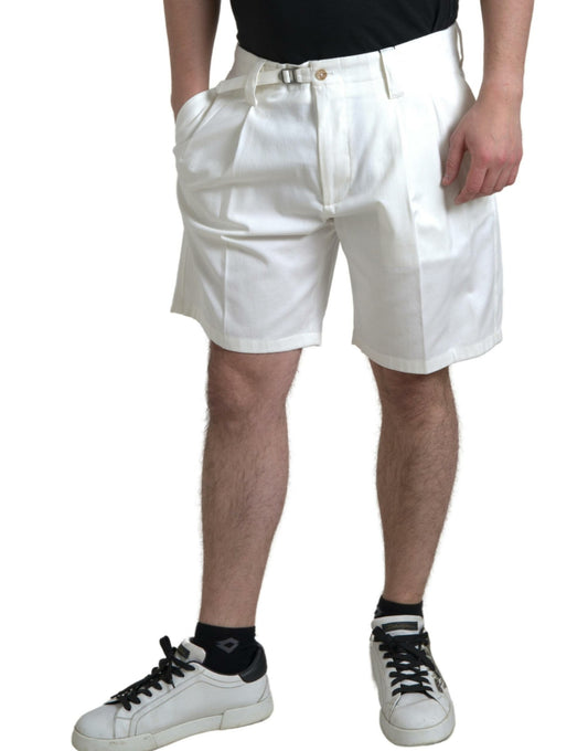 Man wearing white shorts and black sneakers