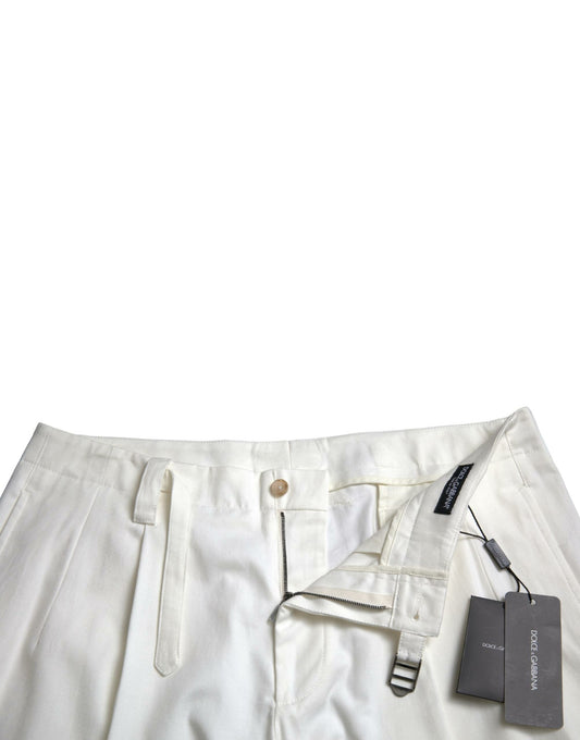 Pair of light beige trousers with a black label on the waistband