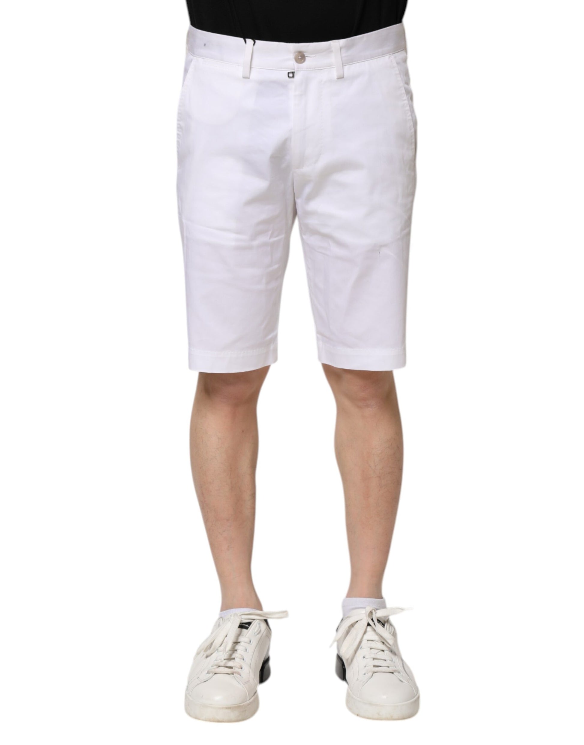 Mannequin wearing white shorts and sneakers