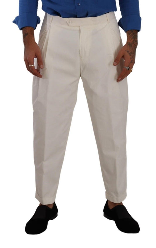Man wearing white pants and black shoes