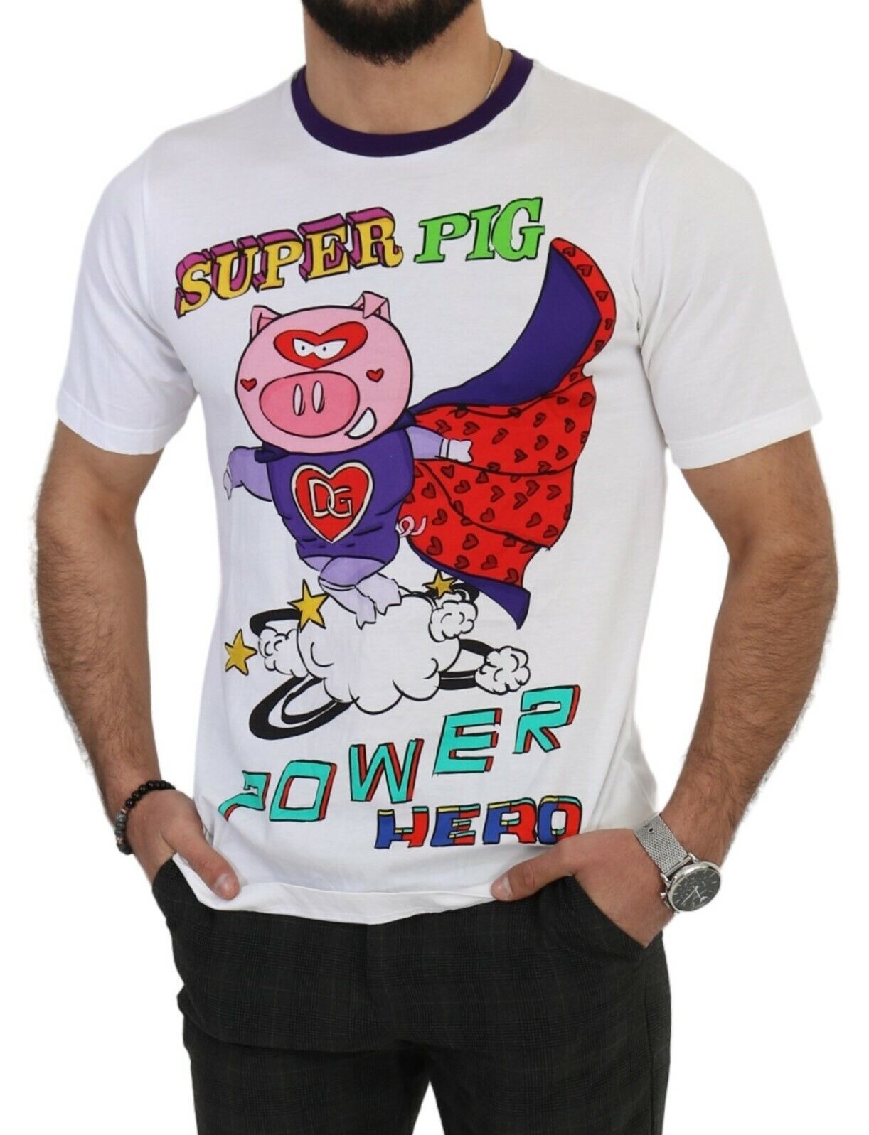 A white cotton t-shirt with a graphic of a pig wearing a cape and flying through the air. The design includes text that reads