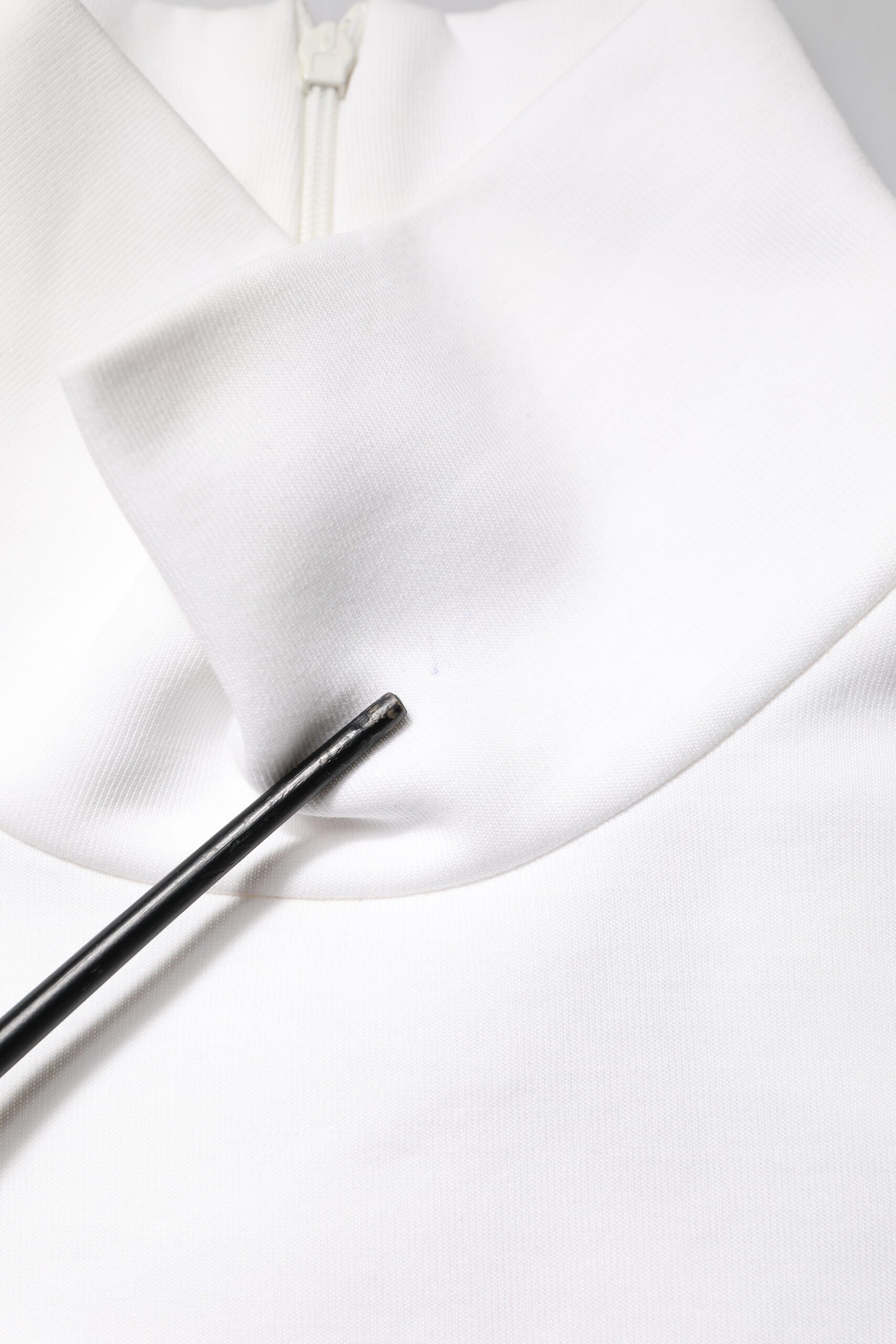 White robe with black zipper