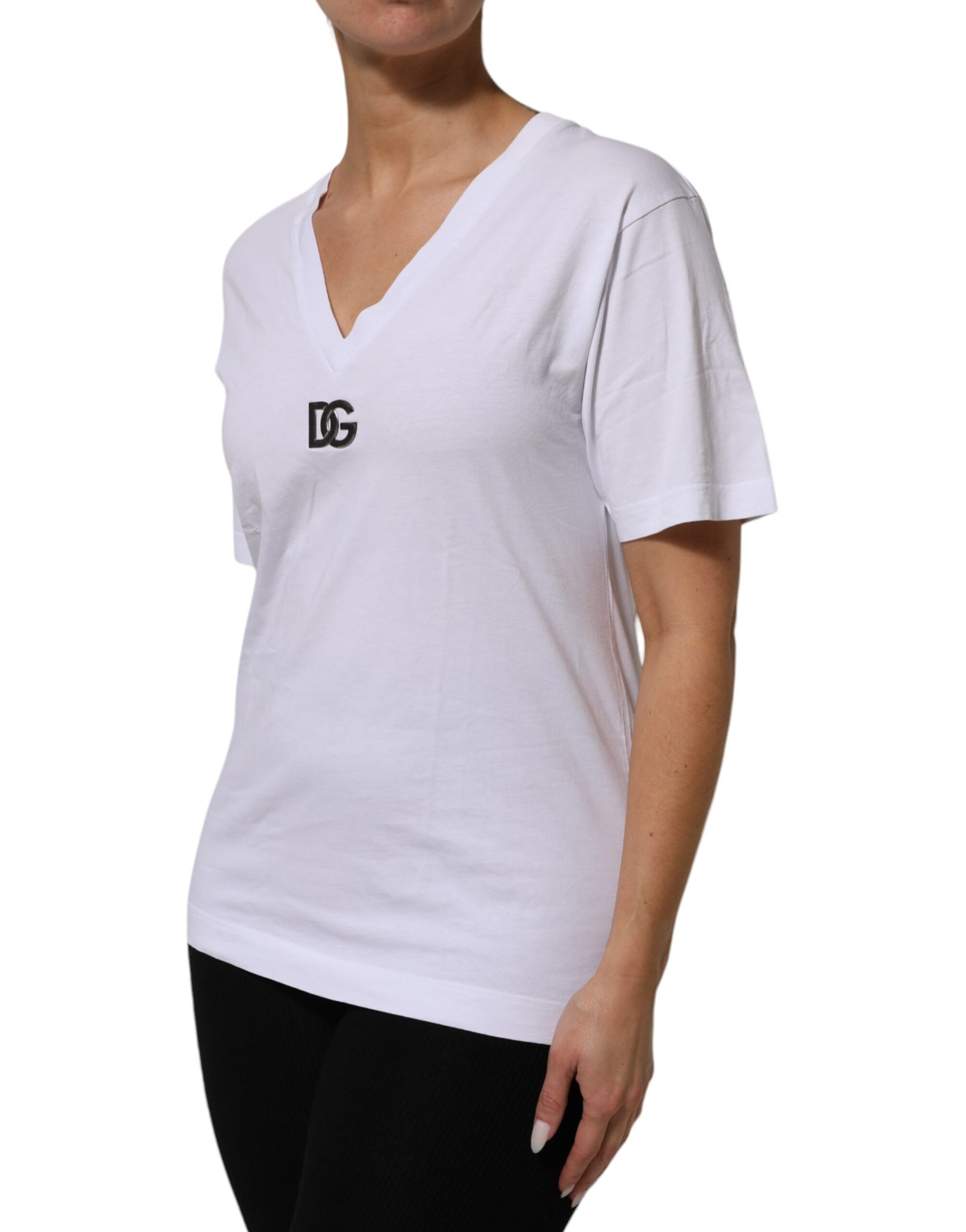Woman wearing white t-shirt with black logo on front