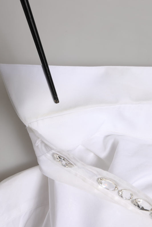 A white dress shirt with crystal embellishments on the collar and sleeves