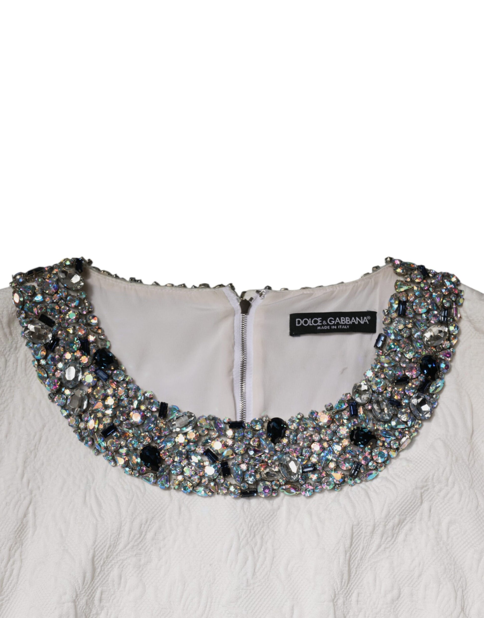 A white jacquard brocade dress with a crystal embellished neckline