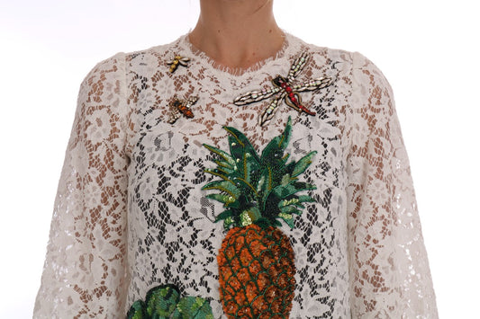 White lace garment with tropical fruit embroidery