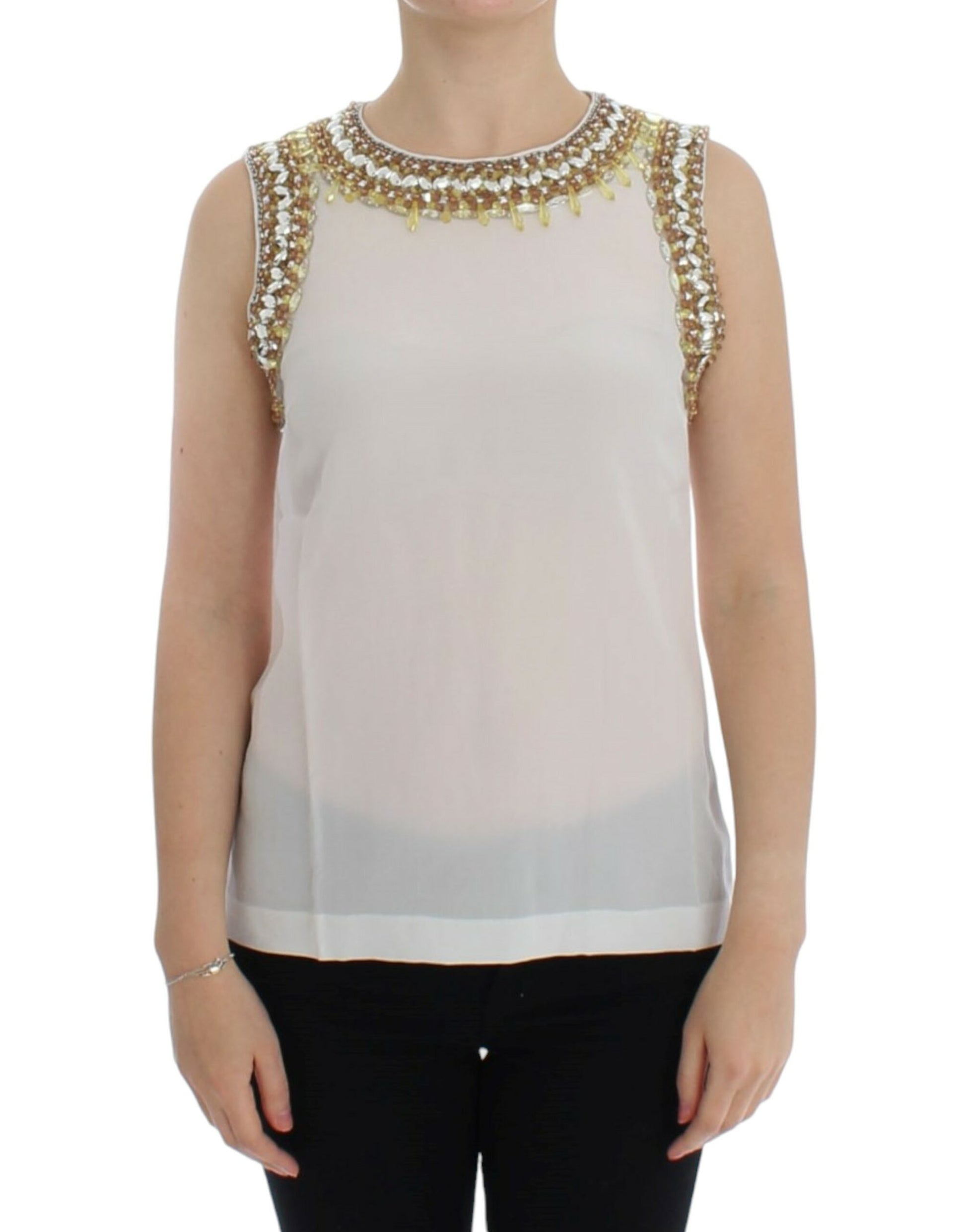 Woman wearing a sleeveless top with embellishments on shoulders