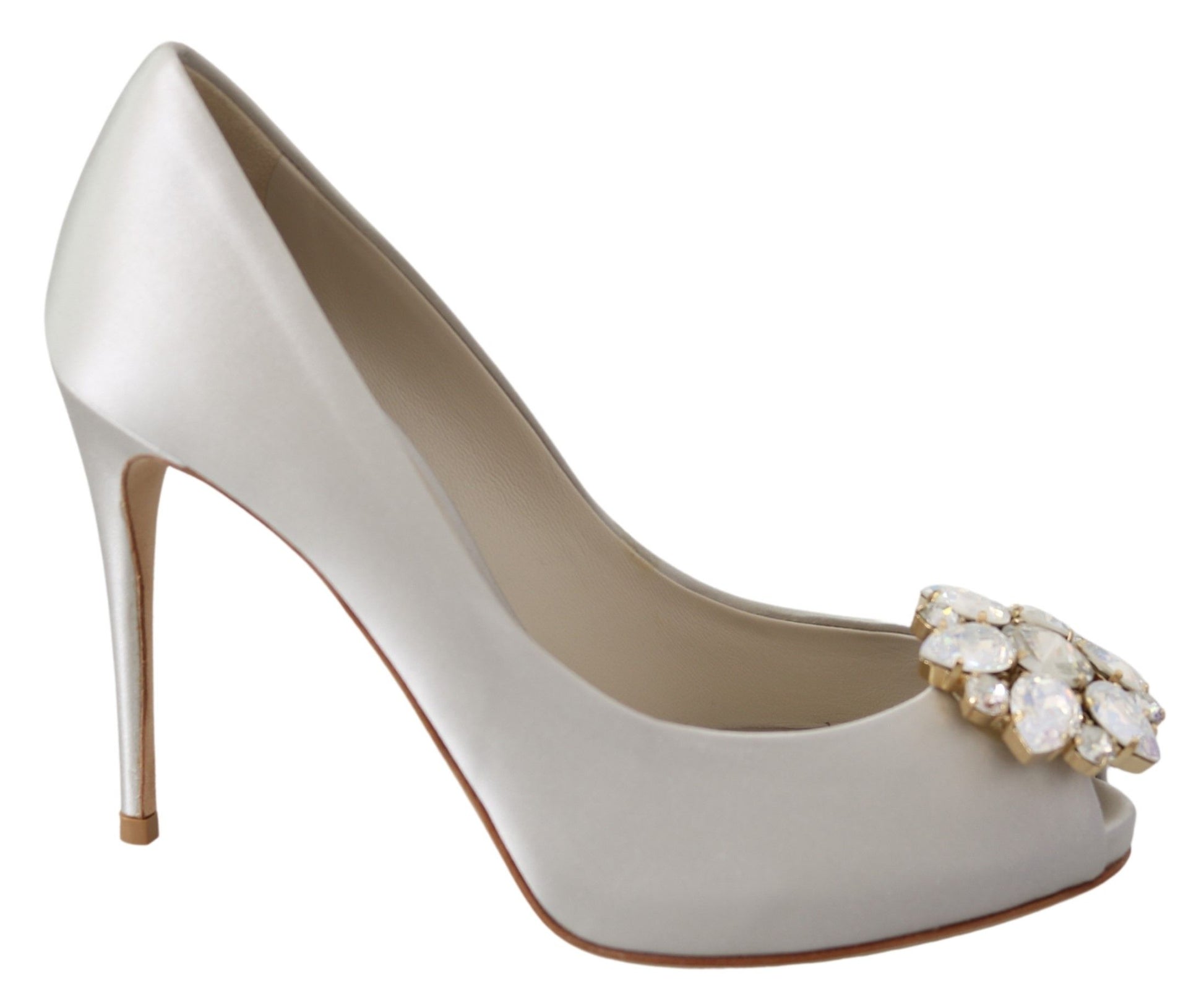 A single high heel shoe with a pointed toe and a stiletto heel. It features a metallic color with a decorative element on