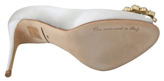 High heel shoe with gold accents and a white sole