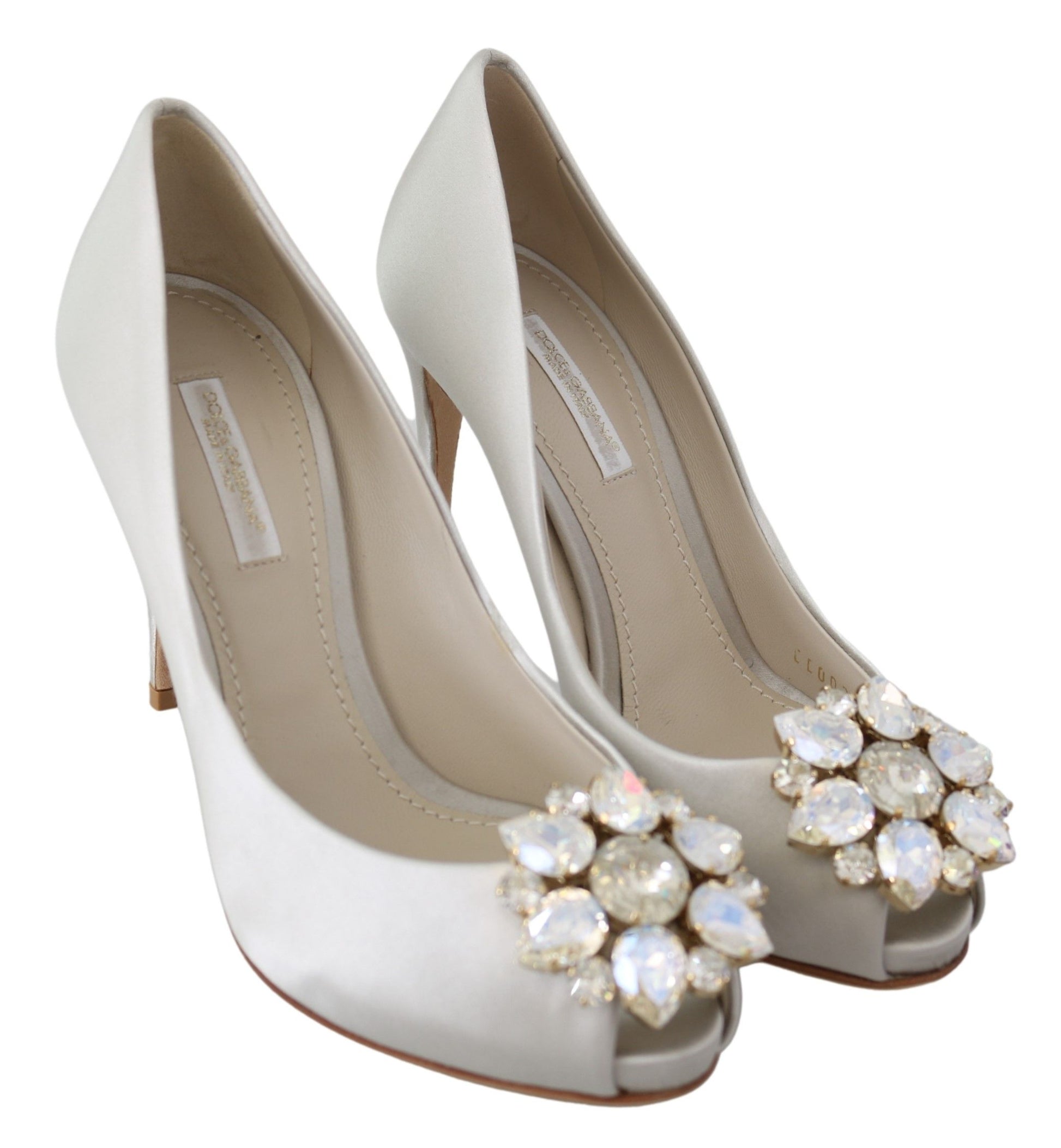 Pair of women's high heel shoes with embellished toe and ankle straps