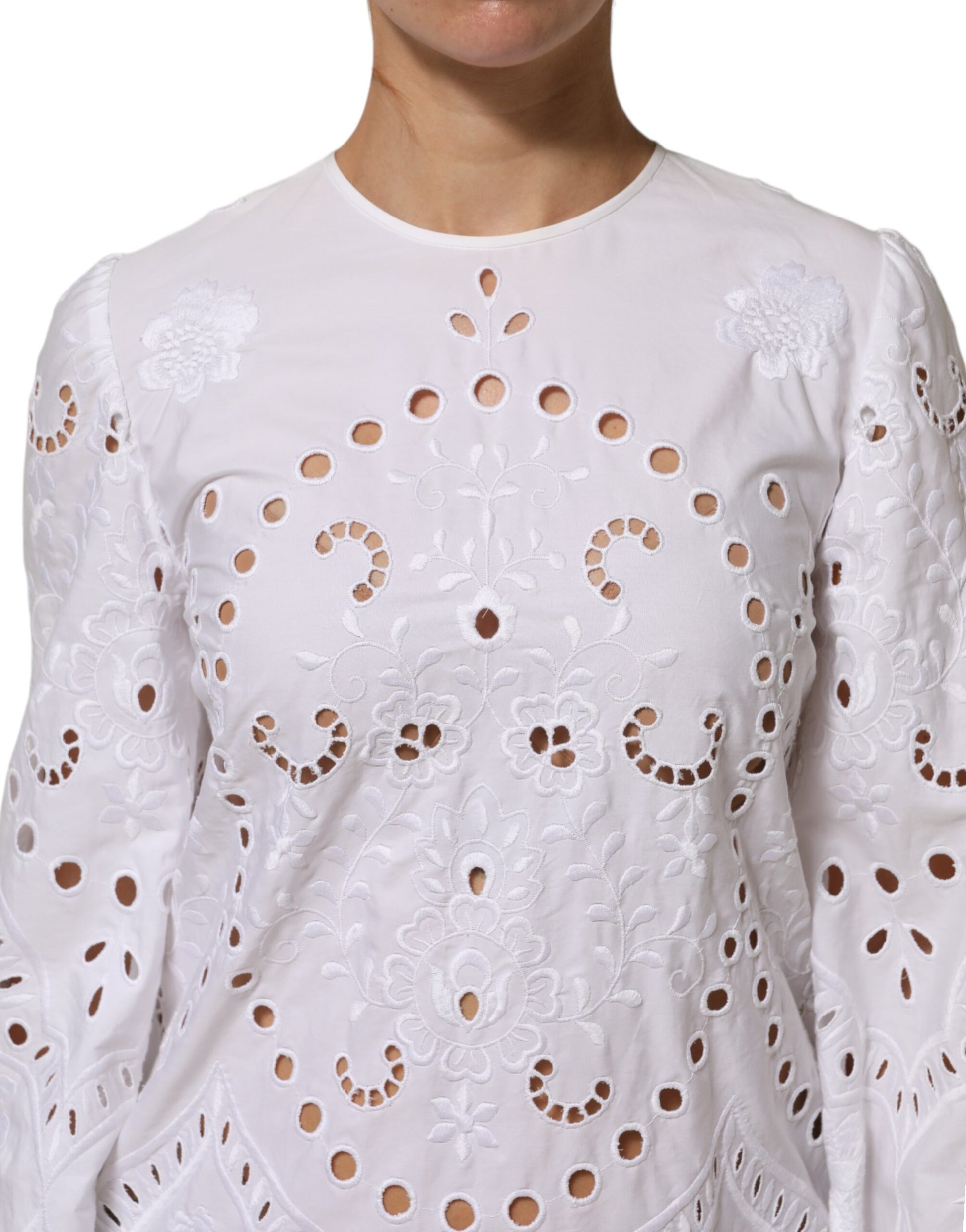White cut out dress with embroidered detailing