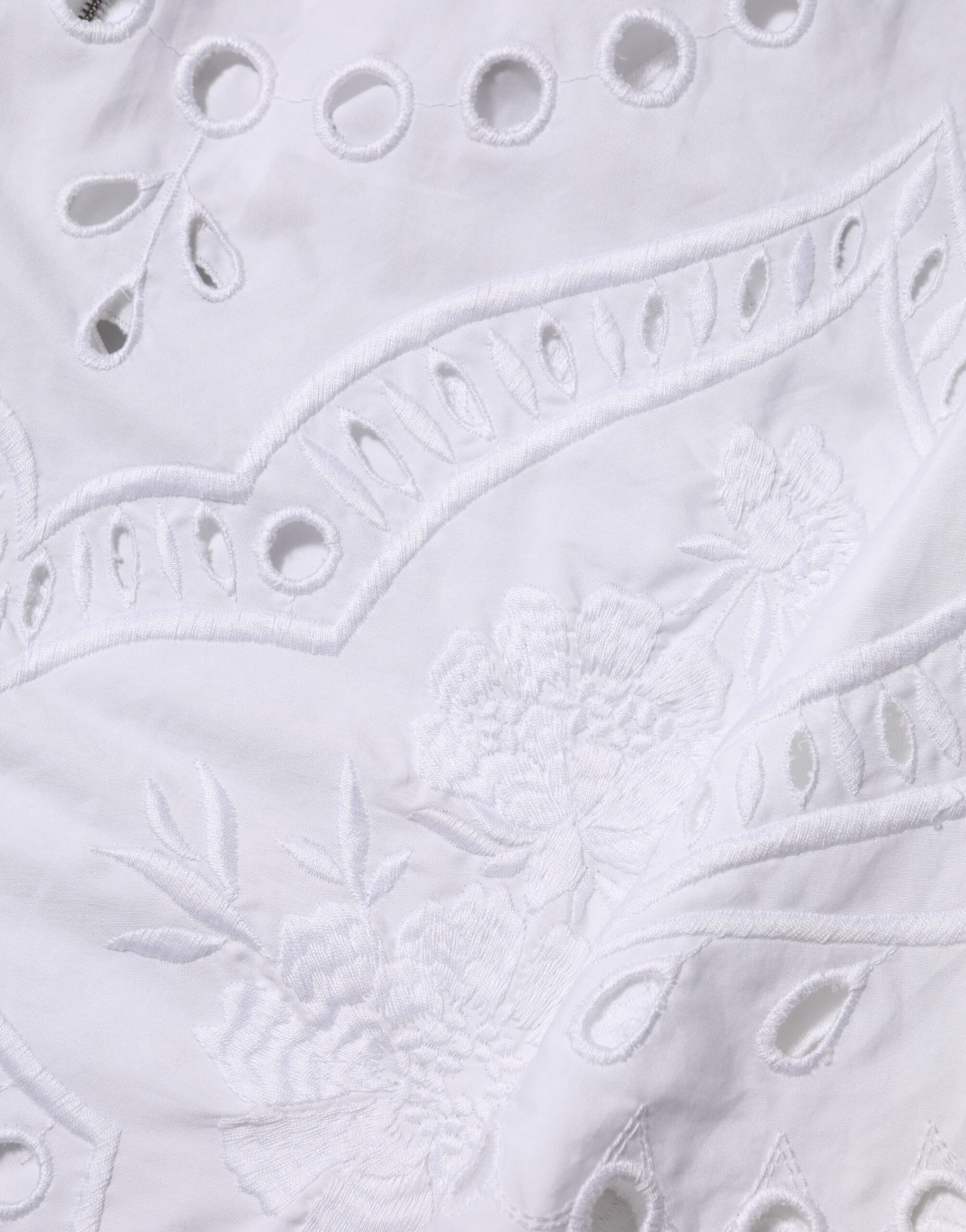 White cut out A-line sheath mini dress with embroidered detailing
