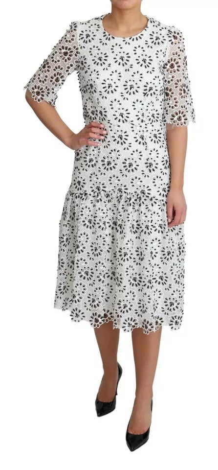 White midi dress with cutout design, polyester fabric, and A-line silhouette