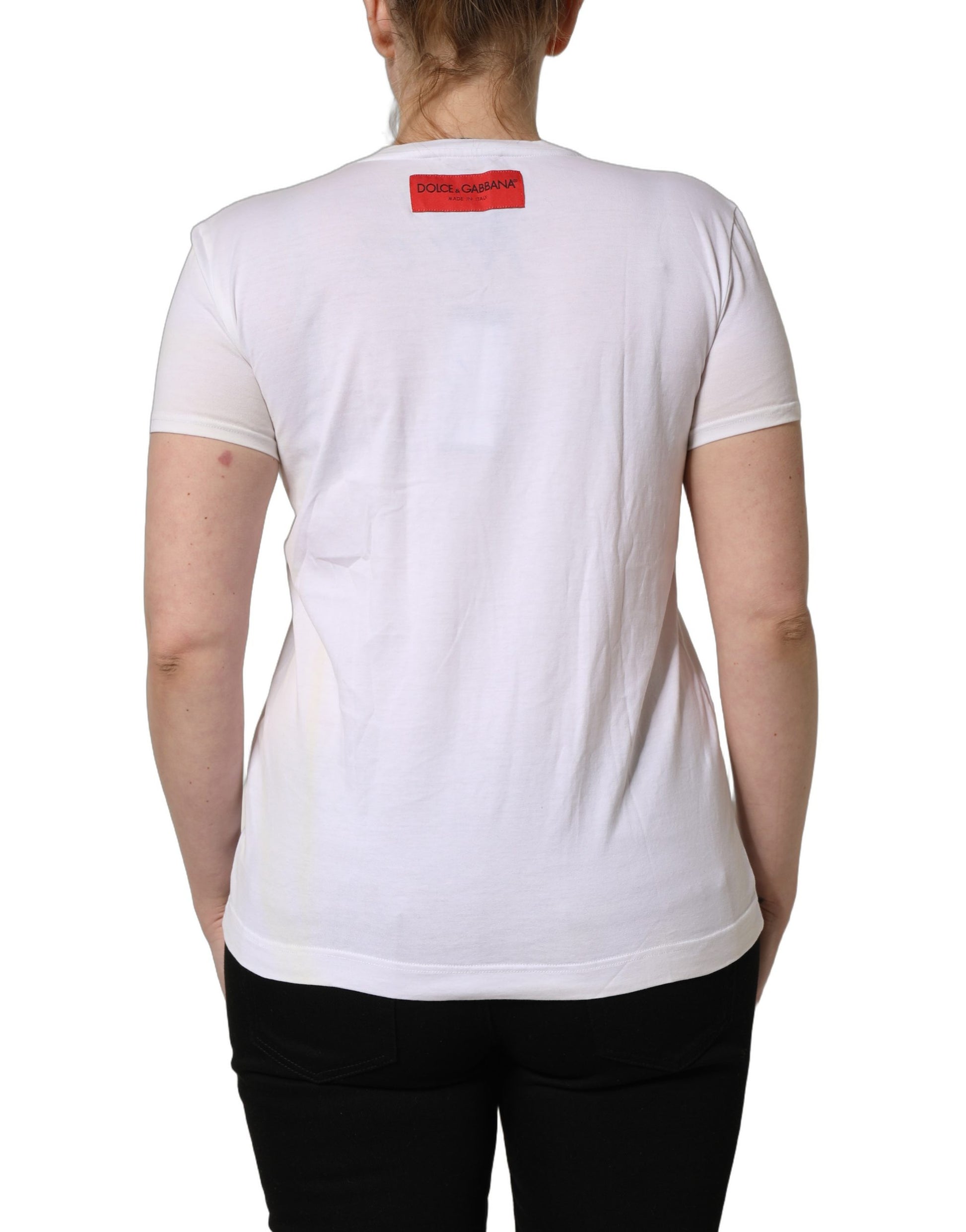 A white t-shirt with a floral print on the back, featuring the brand name "D&G" in red
