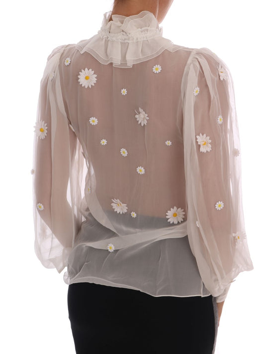 Back of a woman's shirt with floral pattern and ruffled sleeves