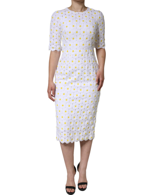A white midi dress with a lace bodice and macramé daisy pattern