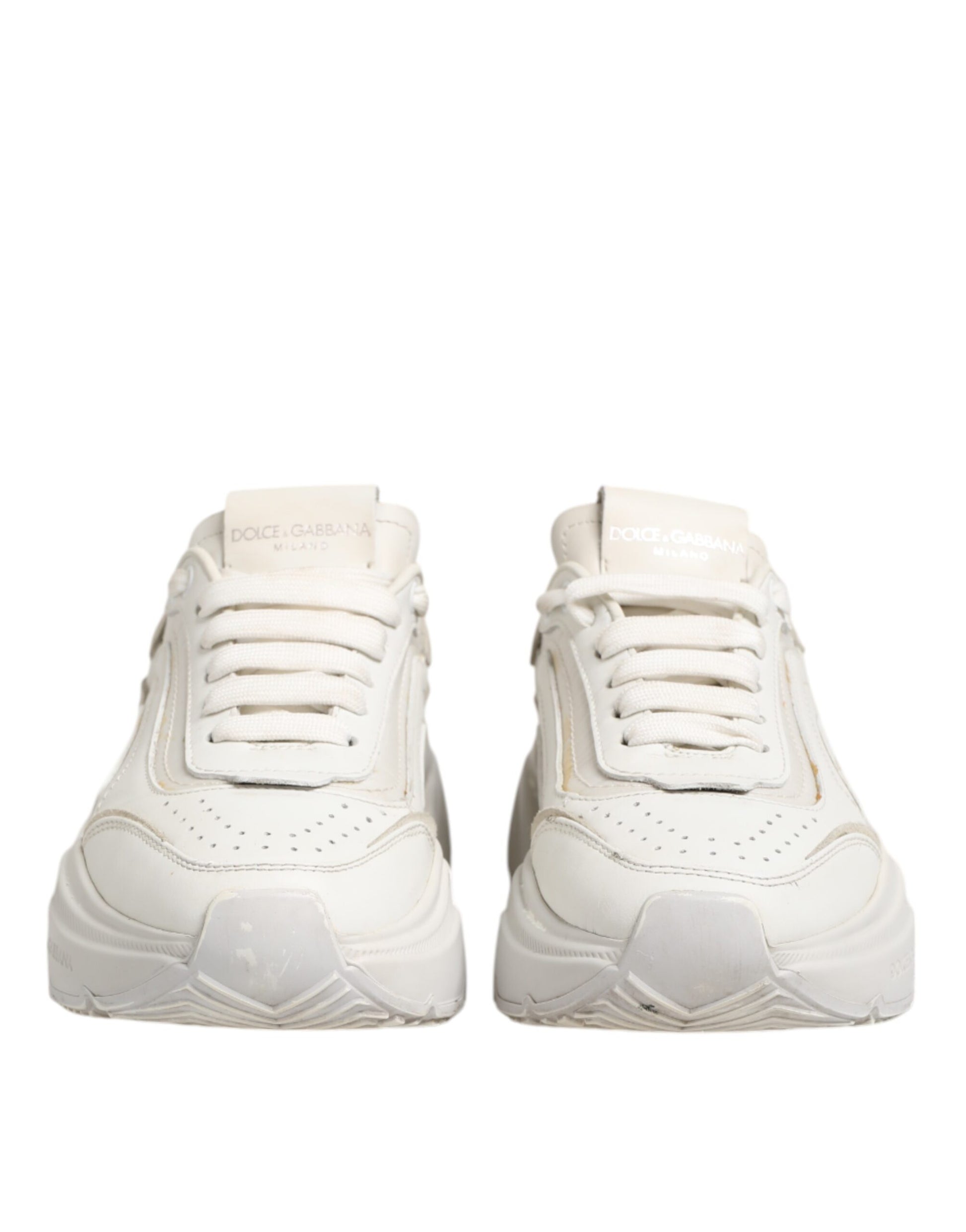 Pair of white sneakers with black laces