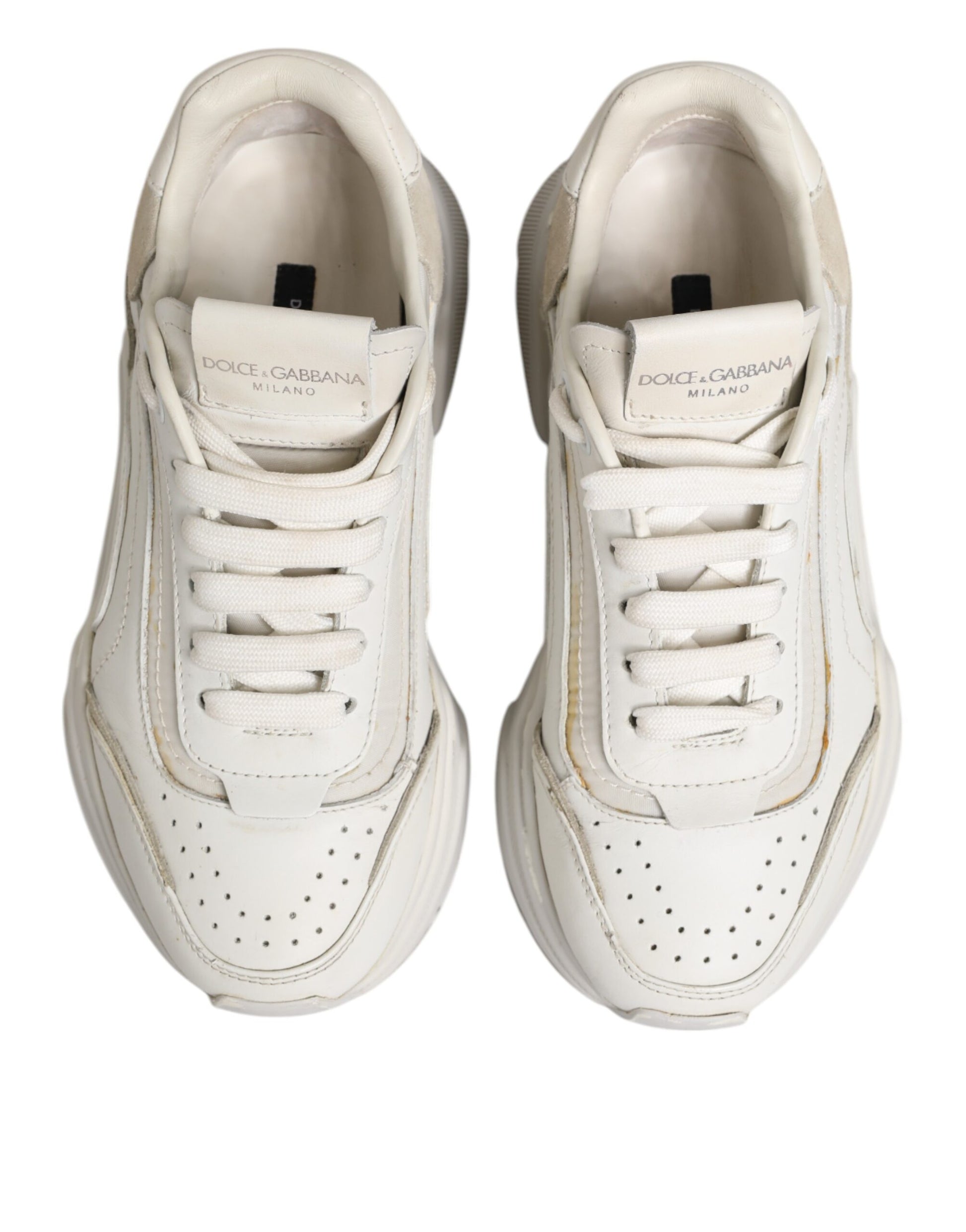 Pair of white sneakers with black laces