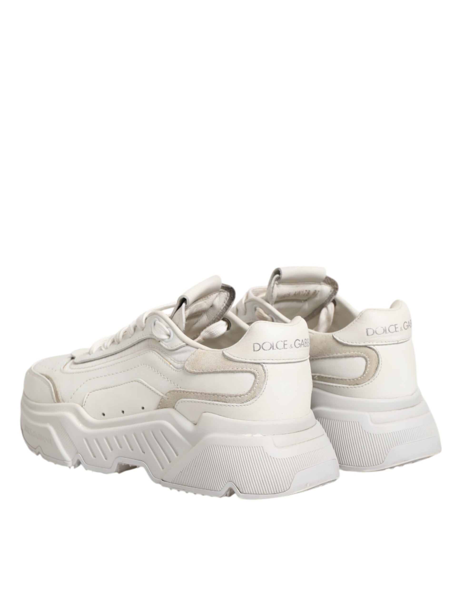 Pair of white sneakers with laces