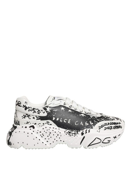 White sneakers with black graffiti design and text, featuring the brand name "Dolce & Gabbana" on side