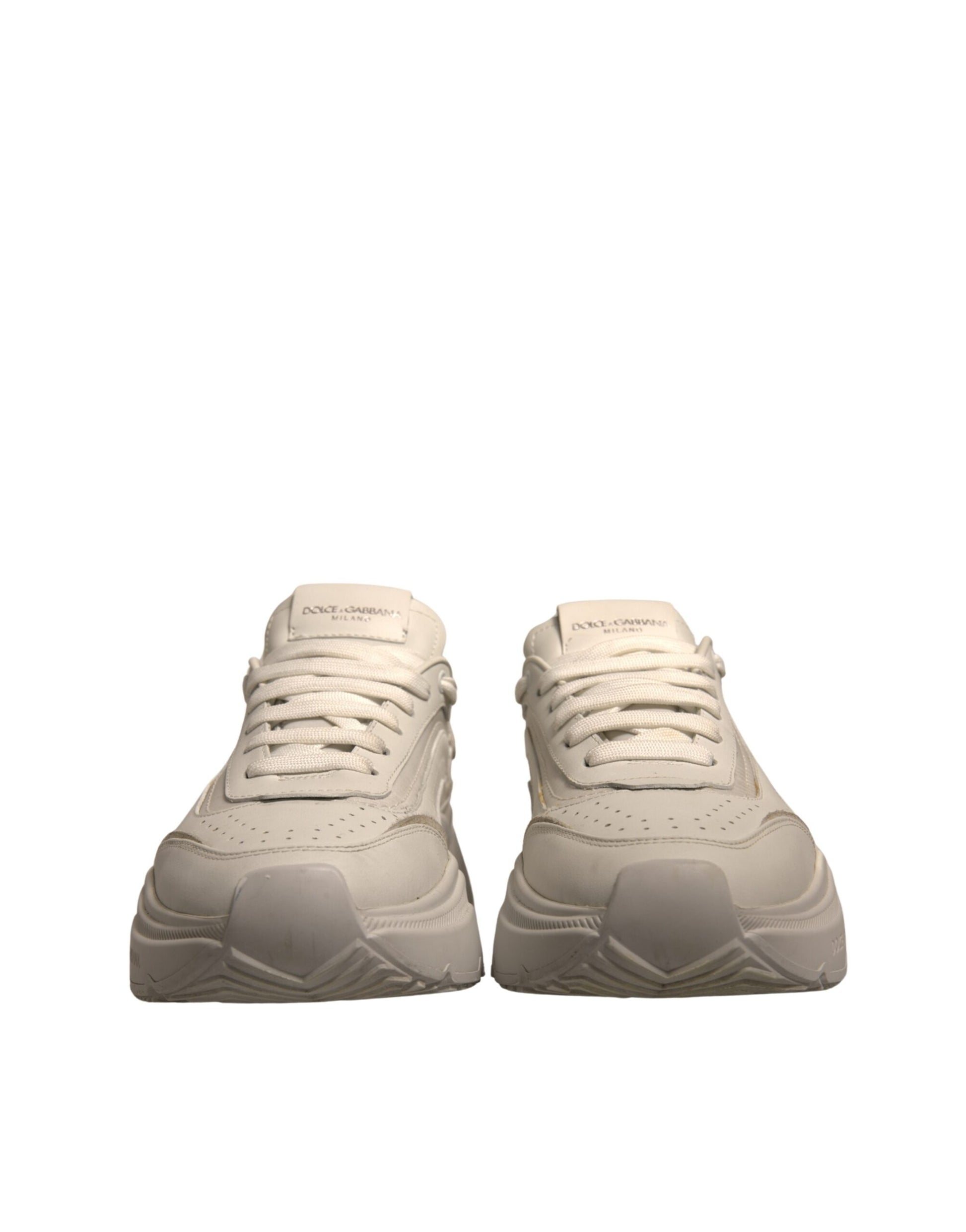 Pair of tan sneakers with white laces