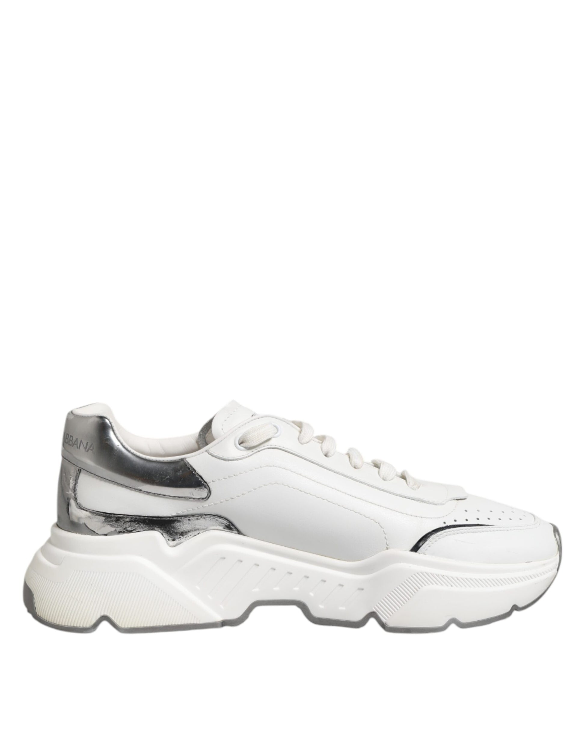 White leather sneakers with black laces, featuring a low top and chunky sole