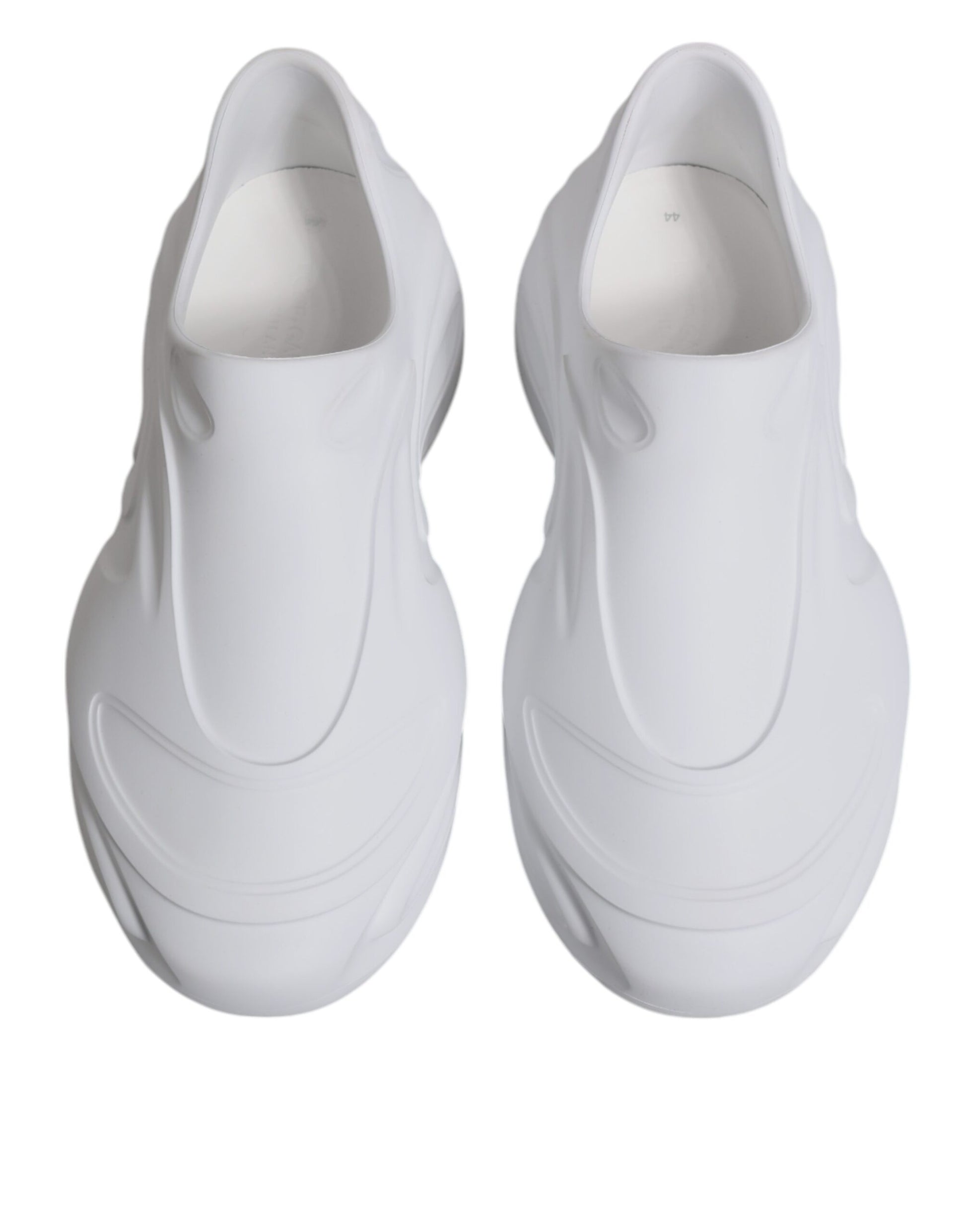 Pair of white sneakers with a design that suggests they are for running or sports activities