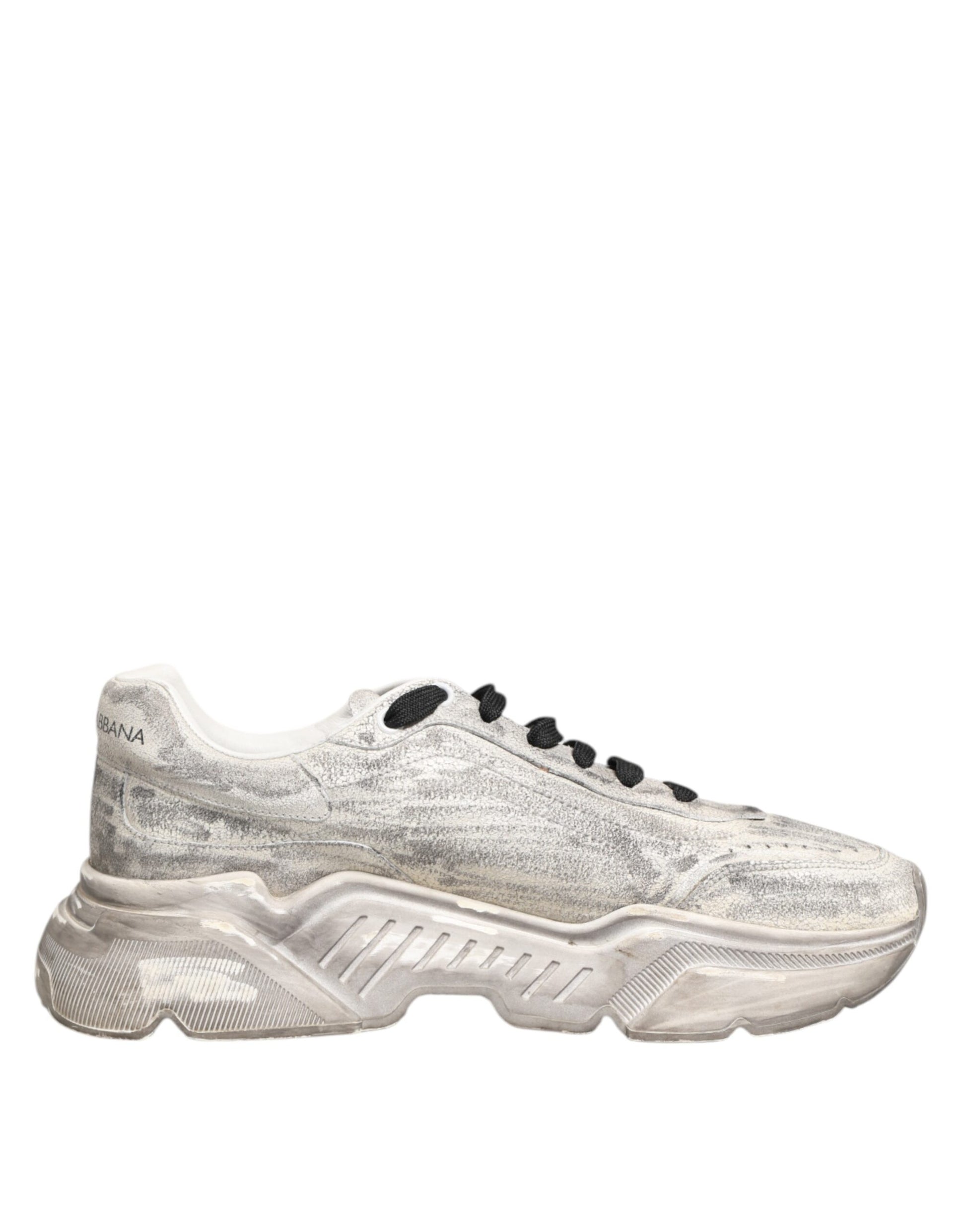 A pair of white sneakers with black laces, featuring a glittery texture and the brand logo on the side