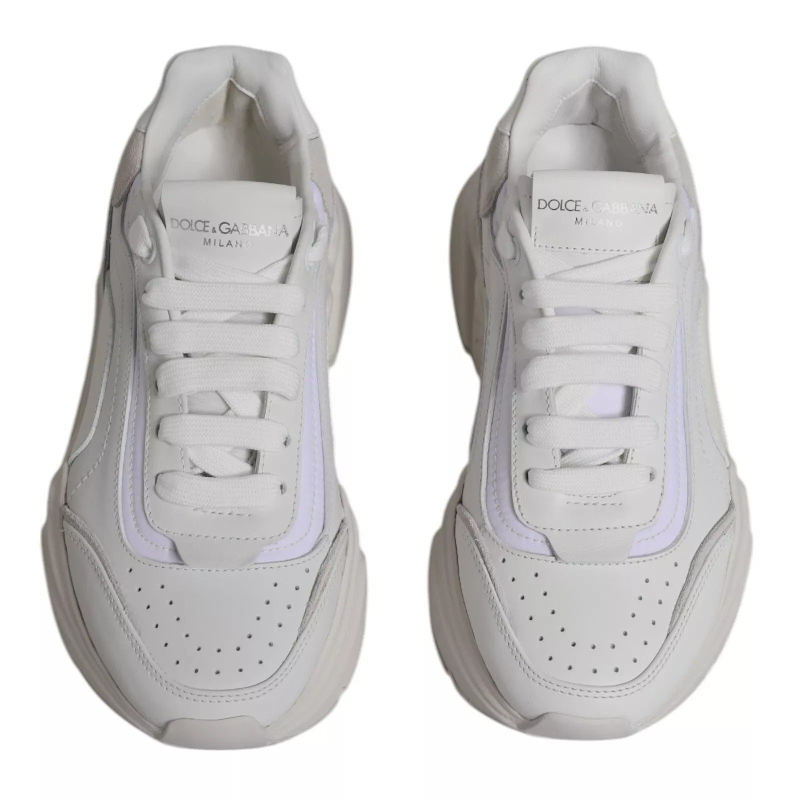 Pair of white sneakers with pink accents