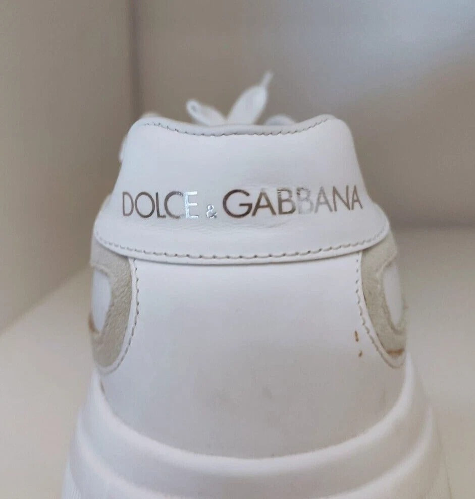 White sneakers with brand name on side