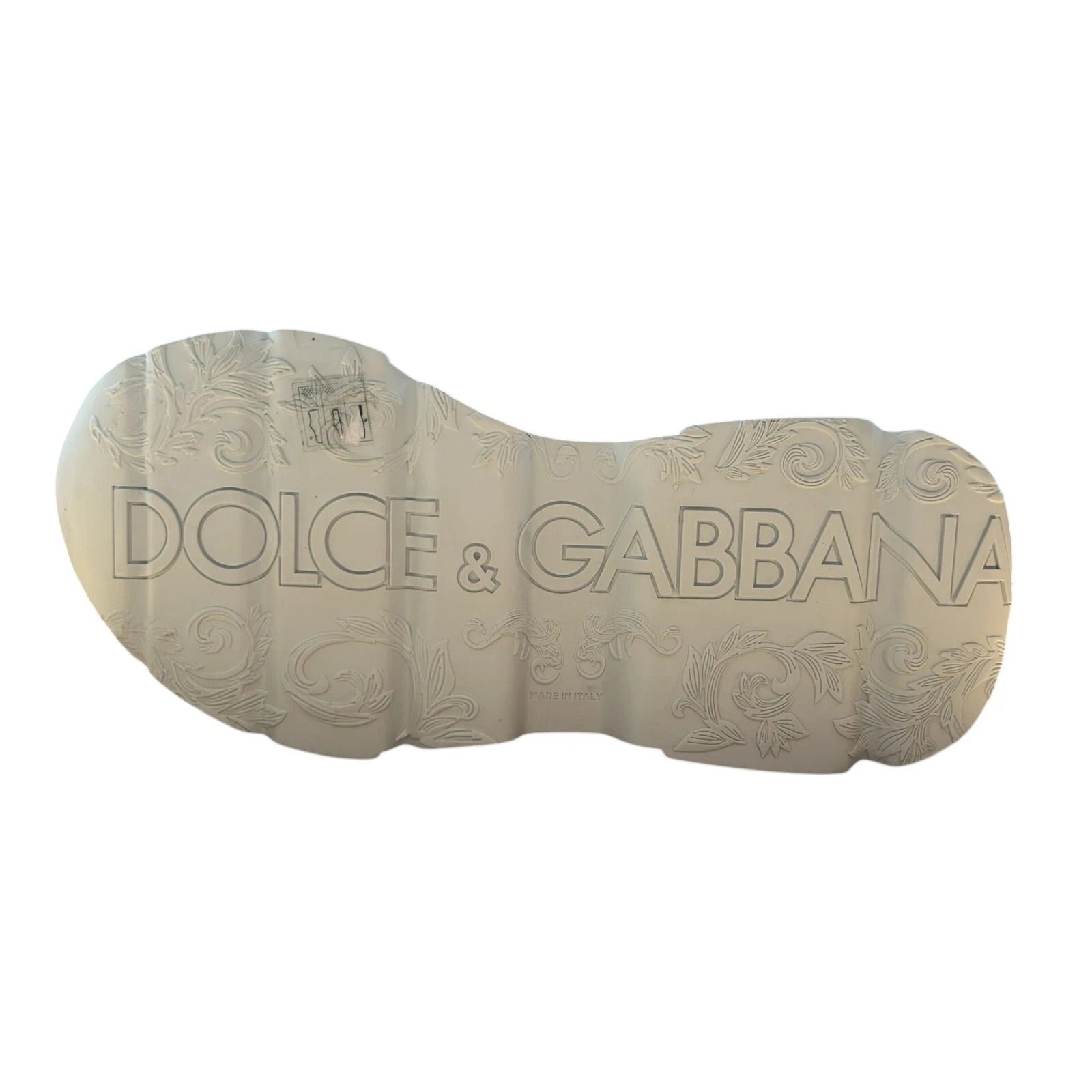 Shoe shaped metal plaque with embossed brand names