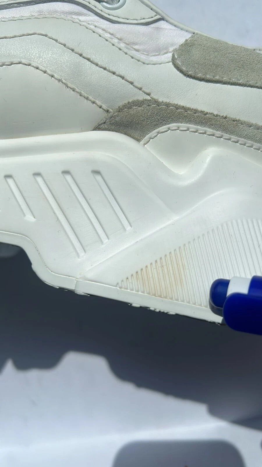 White sneaker with black laces