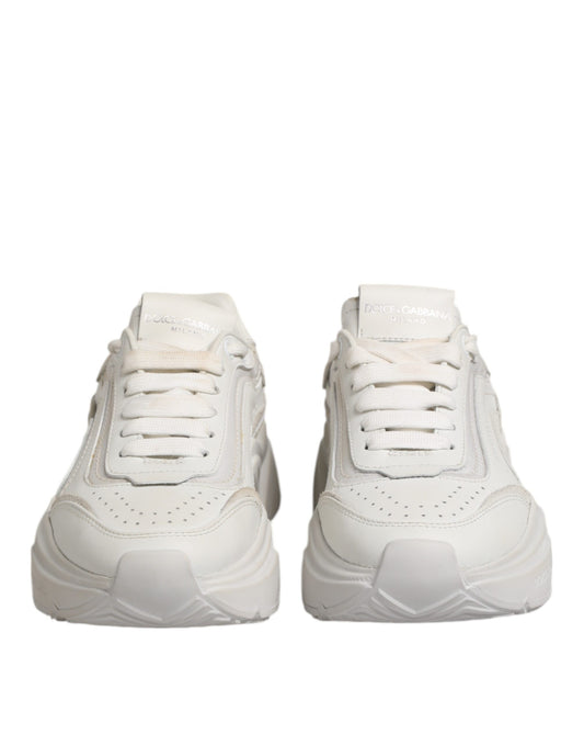 Pair of white sneakers with laces, branded logo on side and back, low top design