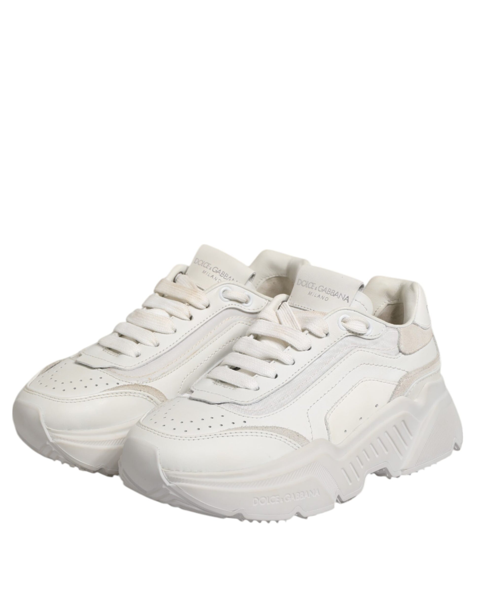 A pair of white sneakers with a low top, featuring a lace-up front and a flat sole