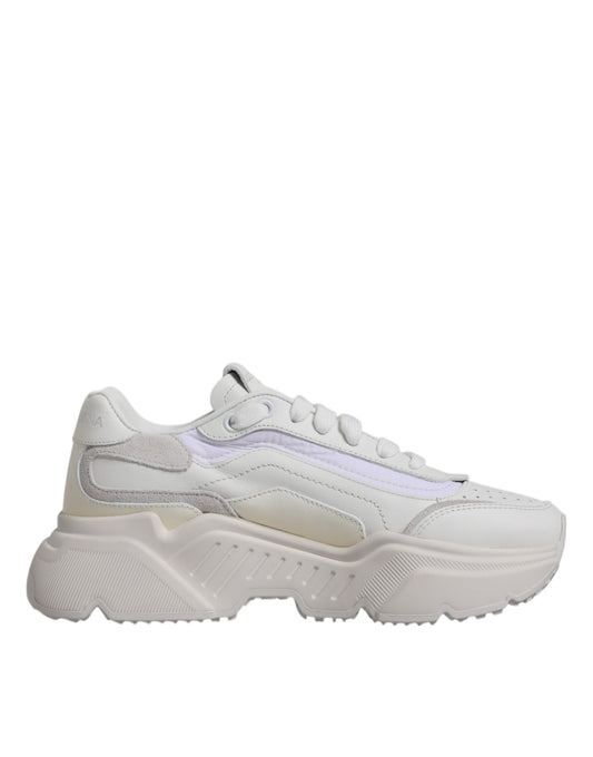 Pair of white sneakers with purple accents