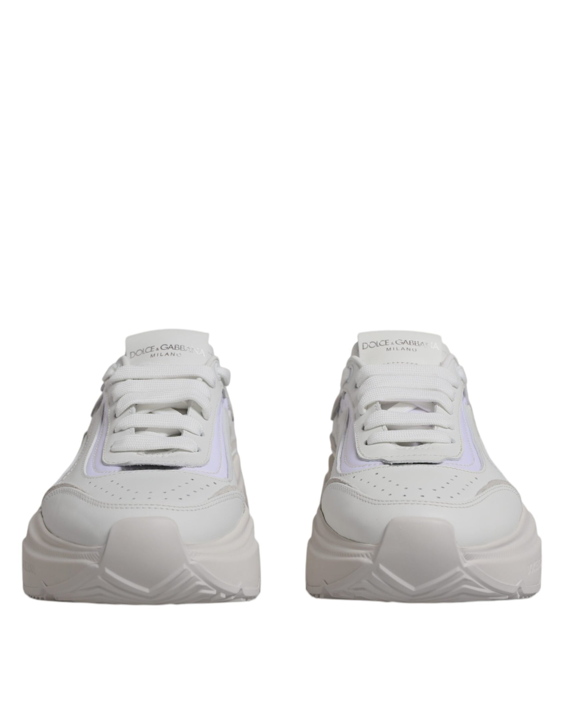 Pair of white sneakers with pink accents