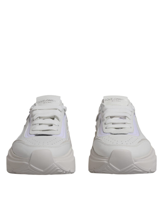 Pair of white sneakers with pink accents