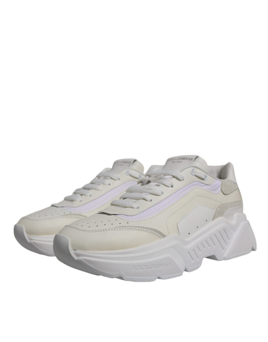 Tan and white sneakers with laces, branded logo on side