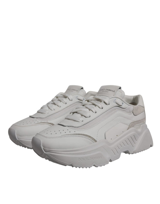 Pair of white sneakers with black laces